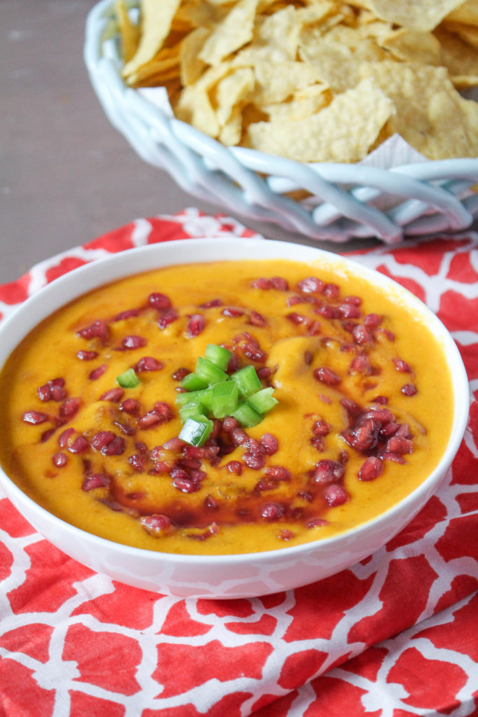 Smoked cheddar and pepper jack cheese is melted into your favorite beer and combined with fresh jalapeno and pomegranate seeds. Warm, sweet, smoky and savory dip for your favorite tortilla chips. 