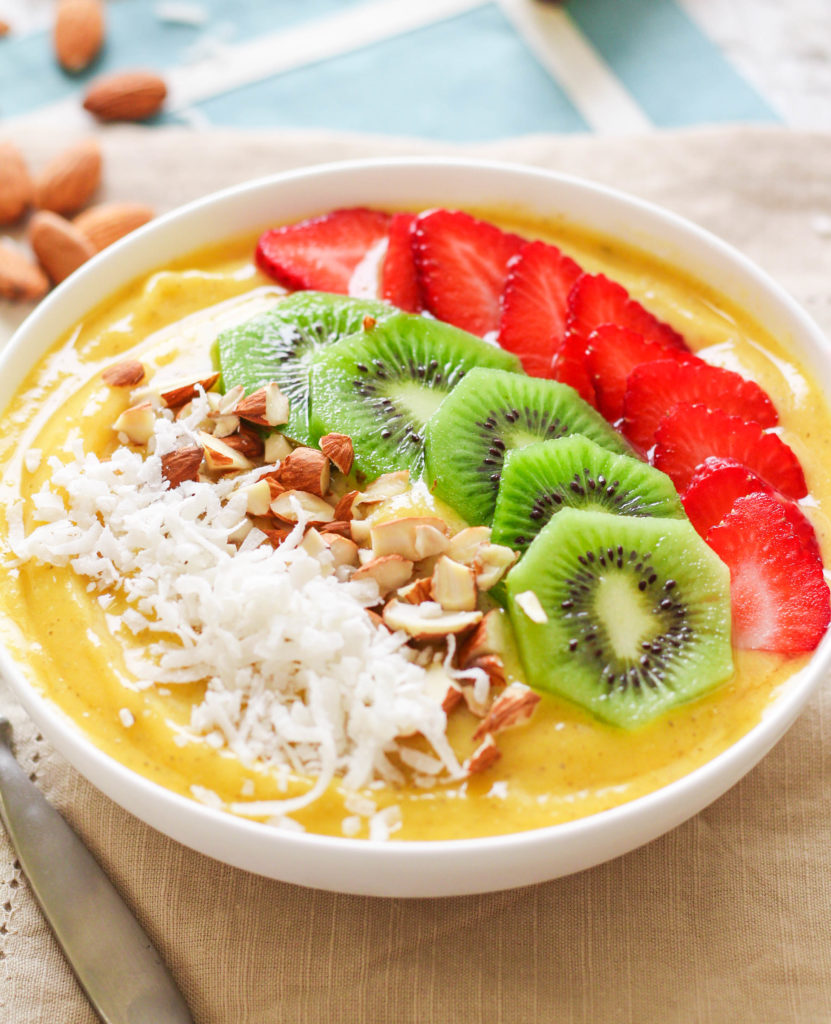 Indulge in the taste of the tropics any time of the year with this tropical smoothie bowl! The addition of turmeric adds anti-inflammatory power, while the fruit and toppings provide plenty of fiber, vitamins and minerals, and anti-oxidants! 
