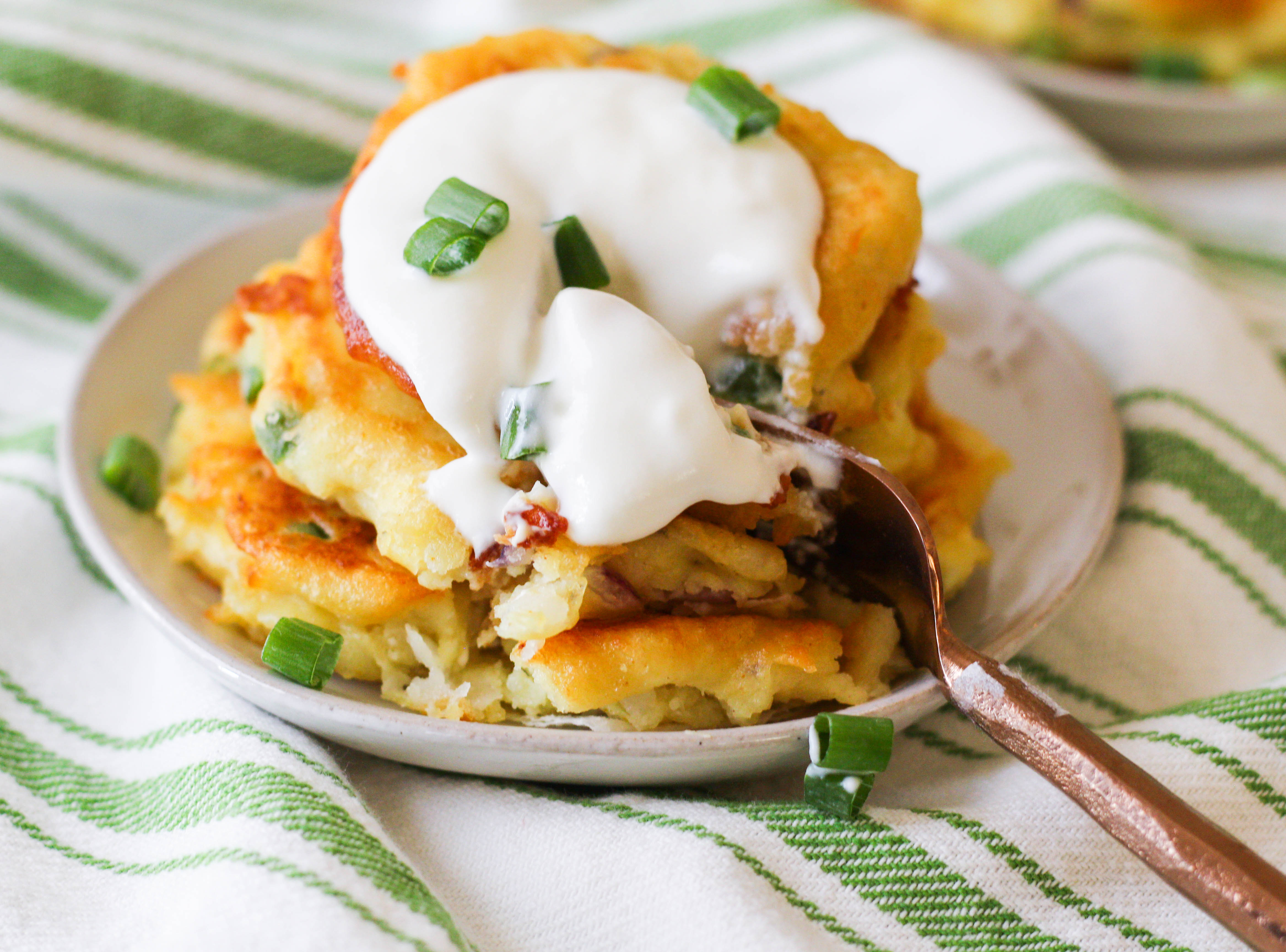 Crispy and golden, these spicy curry potato pancakes are the perfect way to use up leftover mashed potatoes. 