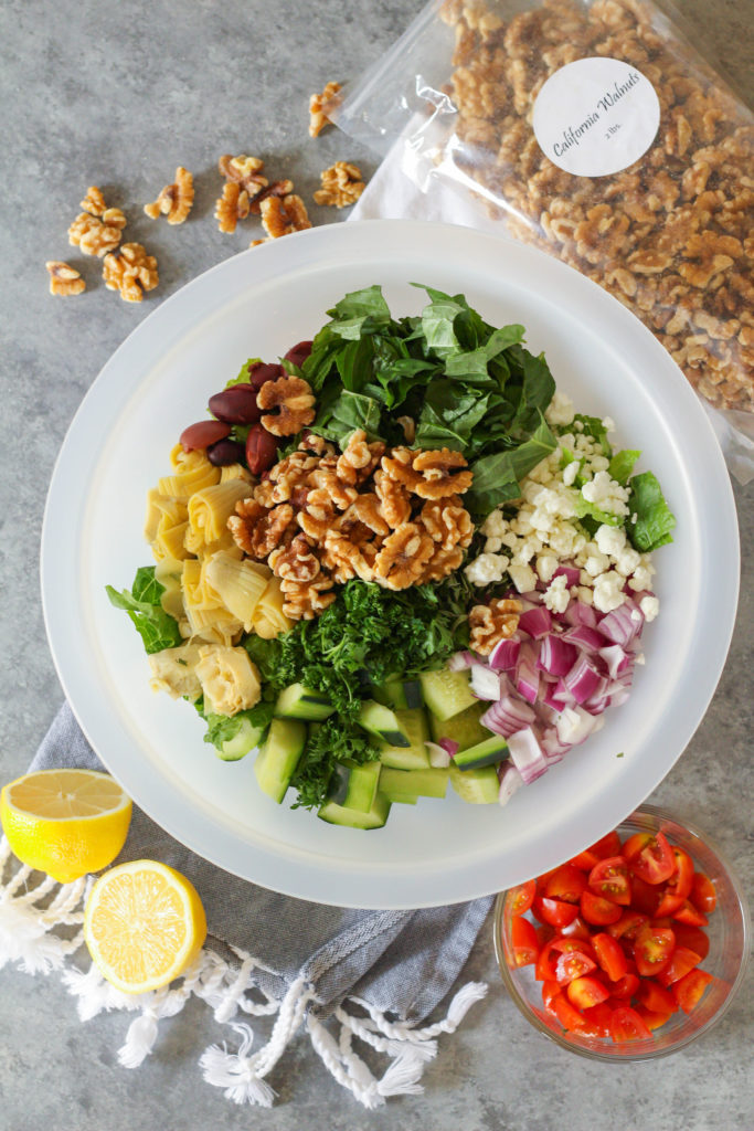 This Chopped Greek Salad is a meal in itself – crunchy veggies combined with savory goat cheese and heart-healthy walnuts, tossed with an olive oil dressing and plenty of fresh herbs and salty Kalamata olives.