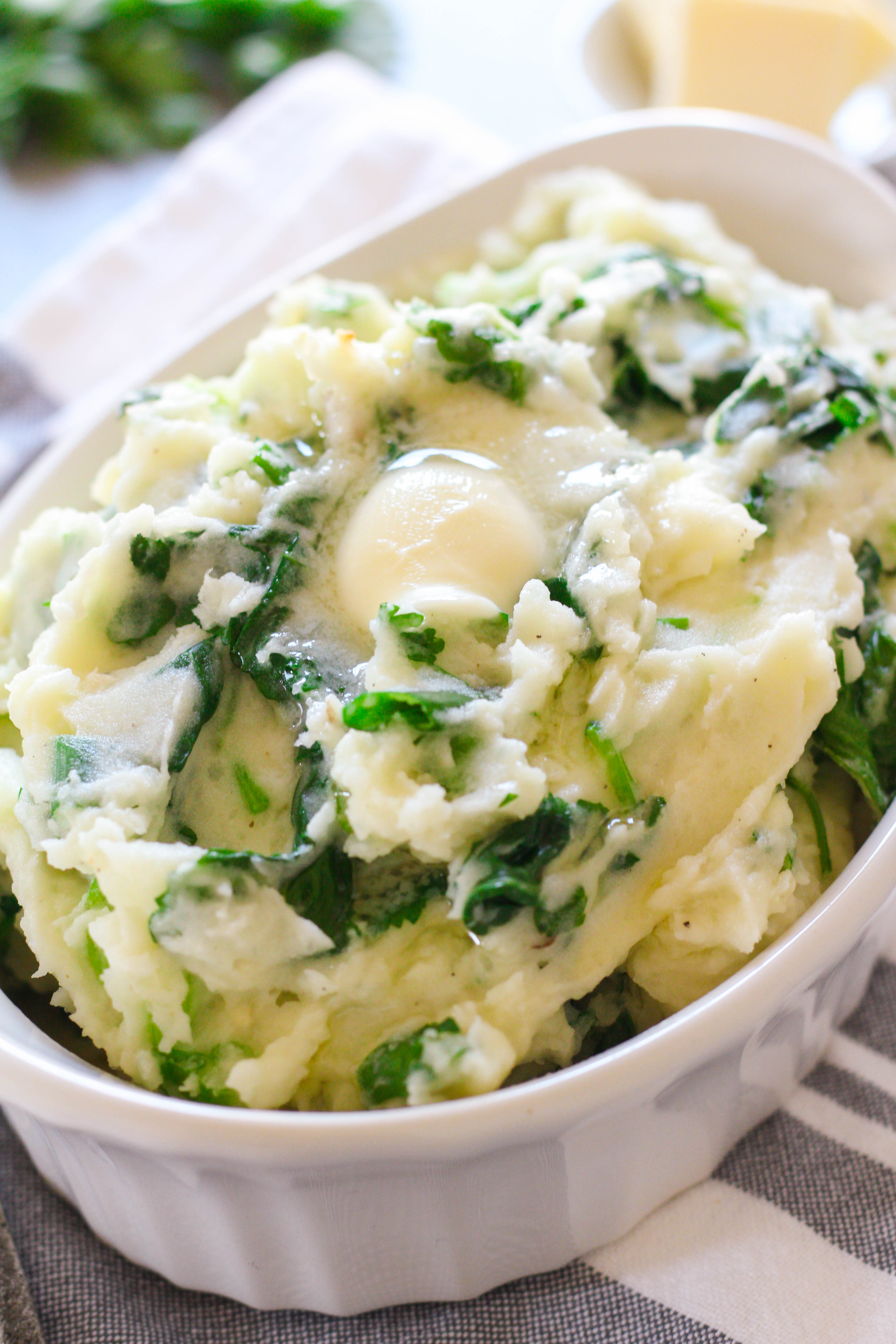 Creamy and buttery whipped potatoes with sauteed tender baby kale, green onions and parsley make up this delicious authentic Irish colcannon. This traditional Irish dish is perfect to serve alongside roasted chicken or a seared steak. 