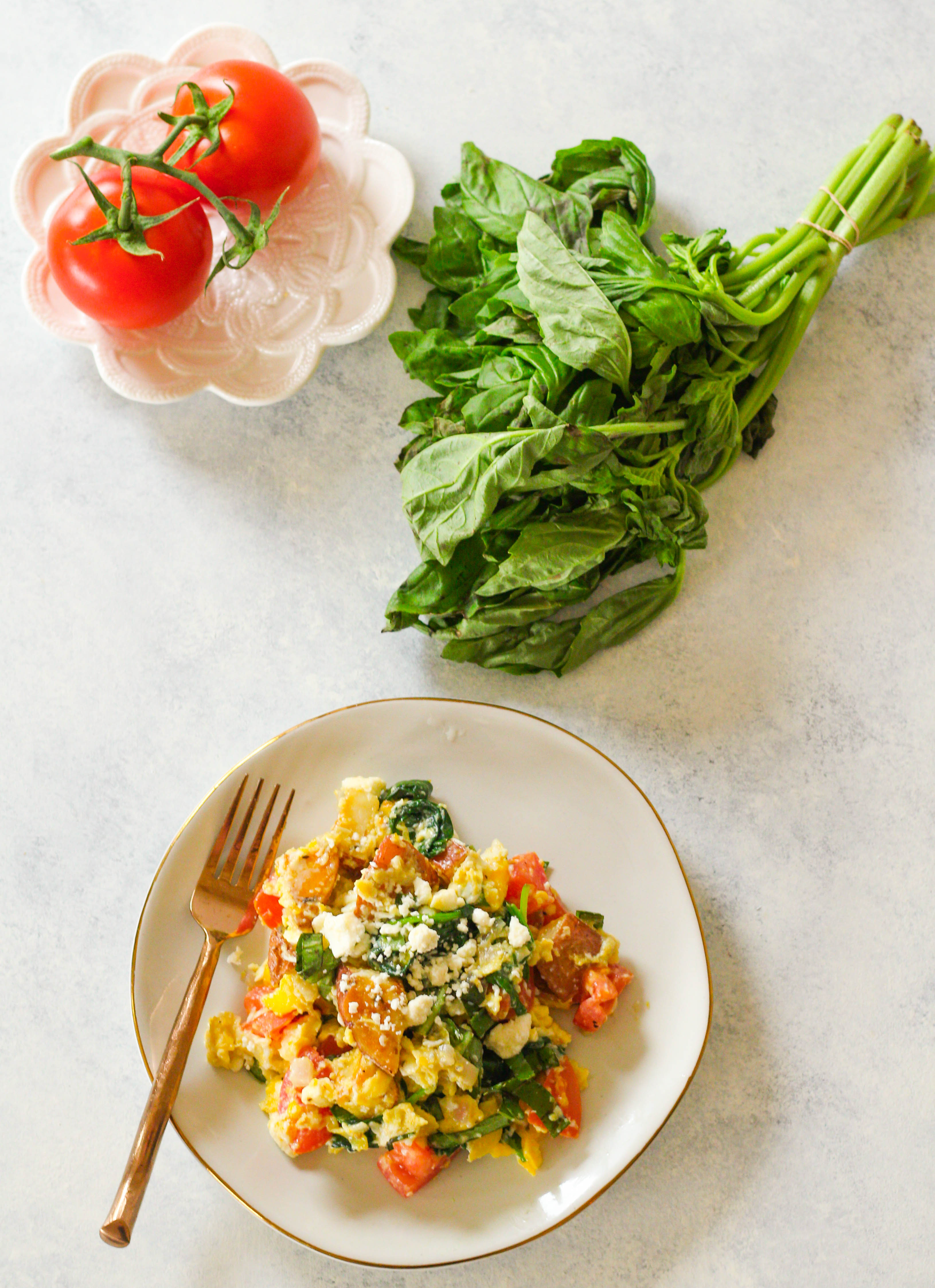 Try this delicious egg scramble: enhance your typical scrambled eggs with Italian-inspired flavors like basil, feta and fresh tomatoes. Tossed with roasted red potatoes for a hearty meal!