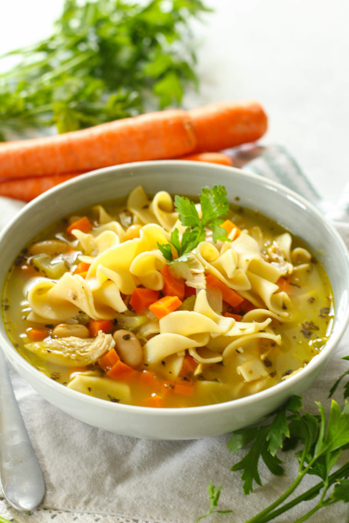 Homemade chicken noodle soup that's ready in under 30 minutes! Full of juicy chicken, tender beans, soft egg noodles and assorted veggies. 