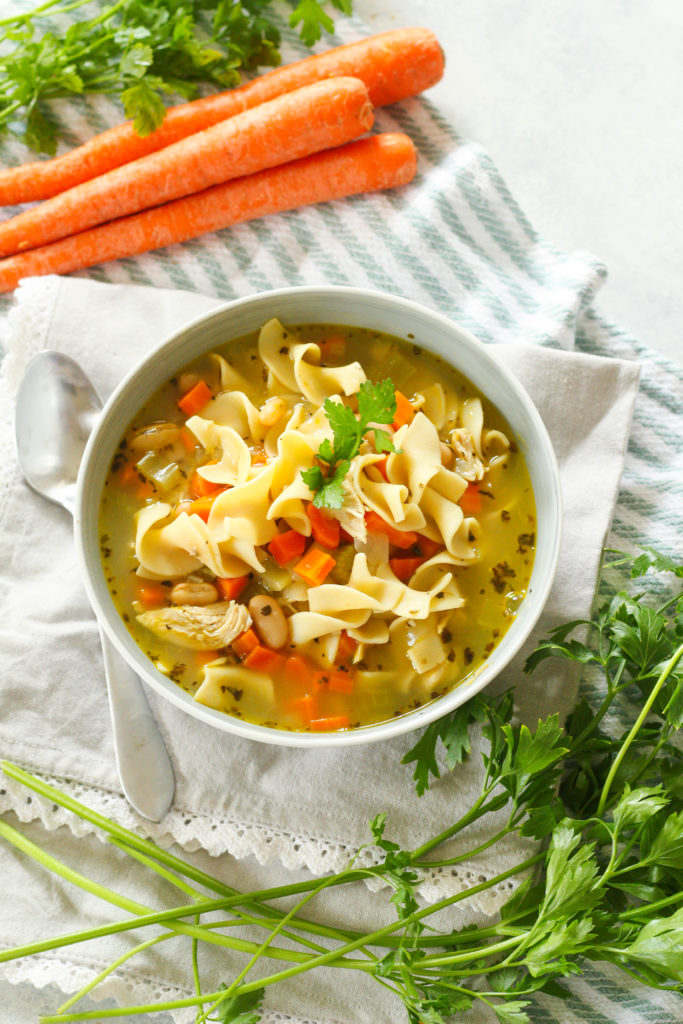 Homemade chicken noodle soup that's ready in under 30 minutes! Full of juicy chicken, tender beans, soft egg noodles and assorted veggies. 
