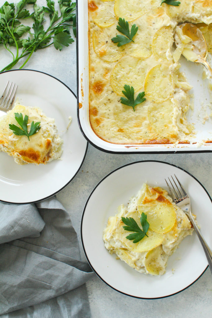 Layers of thinly sliced Yukon gold potatoes covered in a creamy herbed sauce and baked until soft and golden brown. These scalloped potatoes are the perfect comforting side dish to any meal this Fall or Winter season. 