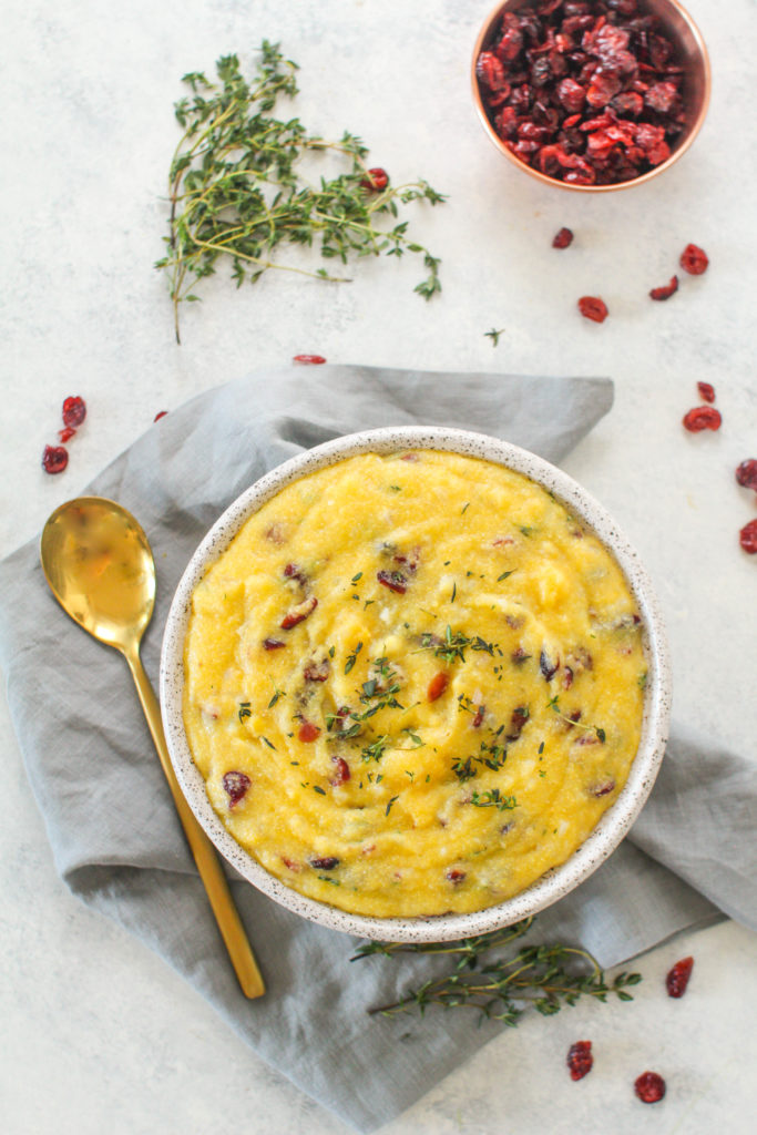 With a porridge-like consistency, creamy polenta is the perfect side dish to serve alongside hearty meat dishes this holiday season. Seasoned with fresh thyme, white wine and dried cranberries, this creamy polenta is sure to be a hit this holiday season! 