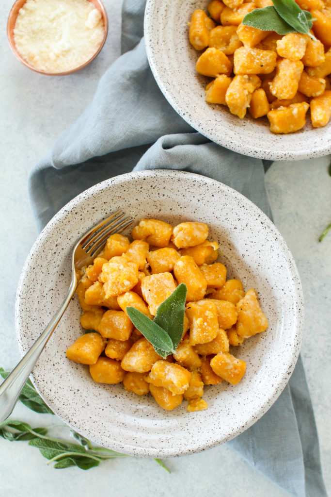 Sweet potato gnocchi are easier to make at home than you think! These pillowy soft and cheesy sweet potato gnocchi are tossed in a sage butter sauce and topped with parmesan. 