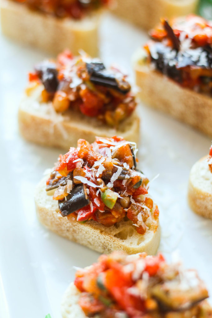 Caponata, a classic Sicilian dish, consists of diced eggplant and veggies in a olive and caper sweet and sour sauce. Eggplant Caponata can be served as-is or on top of sliced crusty bread.
