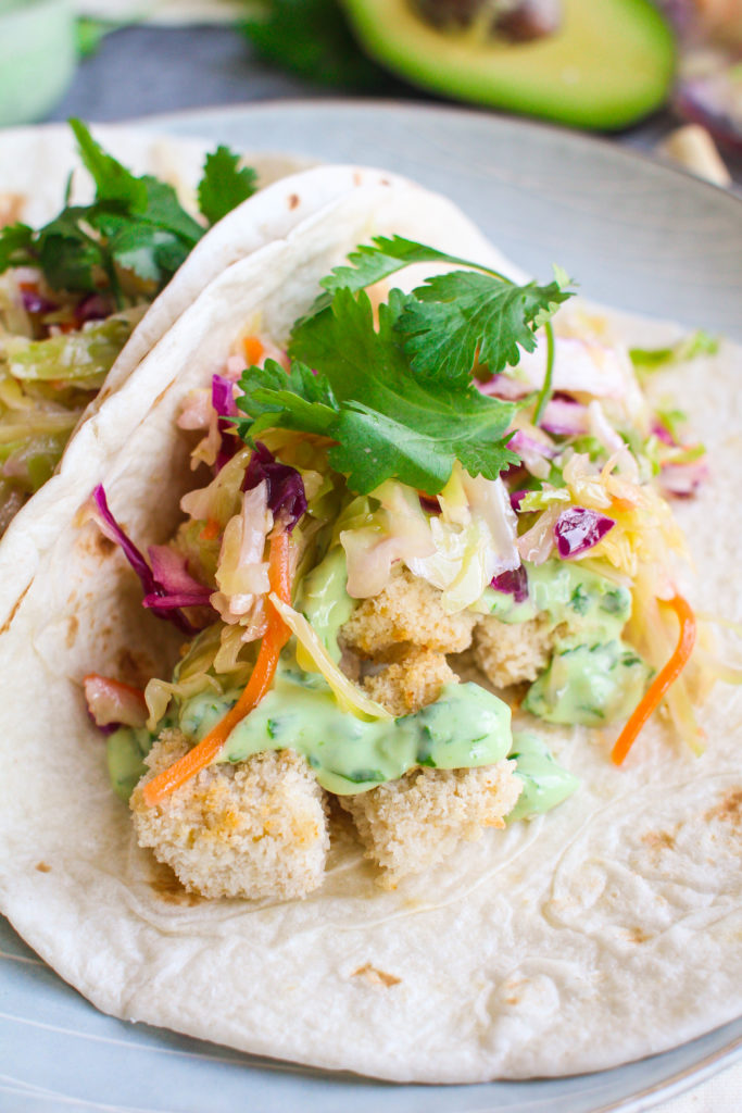 Crispy, garlicky tofu cubes drizzled with a creamy avocado sauce and a handful of zingy crisp slaw. This vegetarian tofu taco dish is sure to please even the tofu skeptics! 