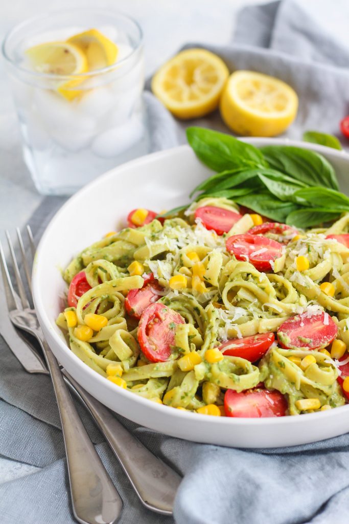 fettuccine with avocado sauce, corn kernels and cherry tomatoes