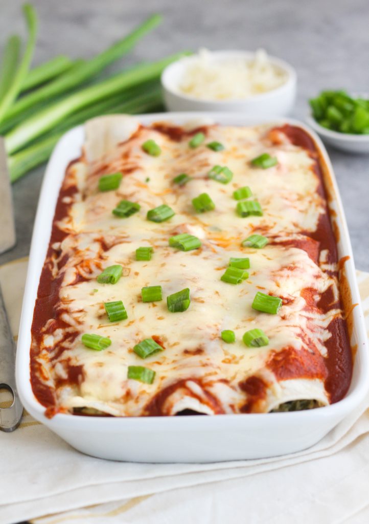 enchiladas covered with red sauce and cheese