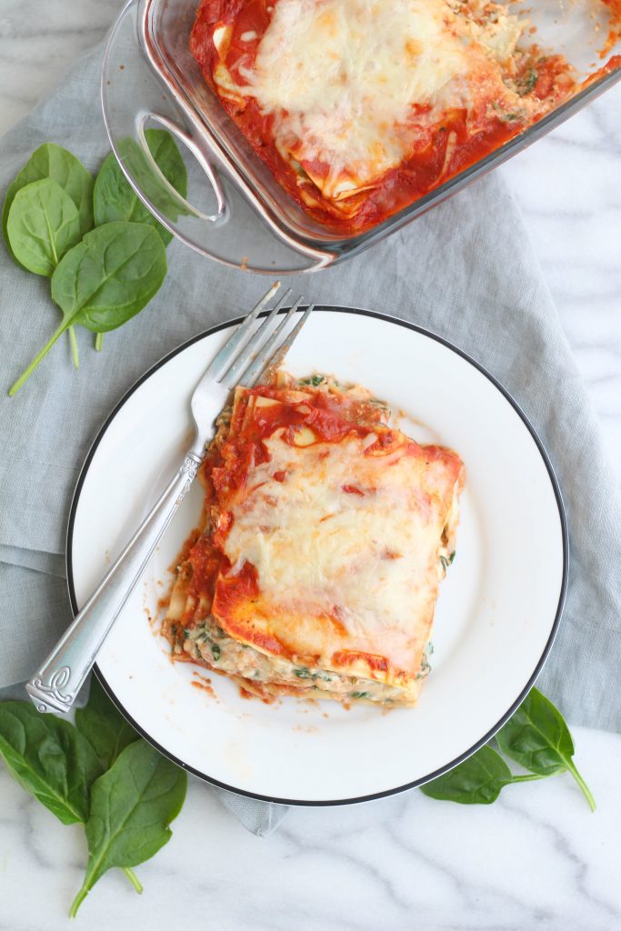 This cheesy spinach lasagna for two is so easy to throw together and tastes delicious! Four layers of ricotta, noodles, sauce, and sauteed spinach.  