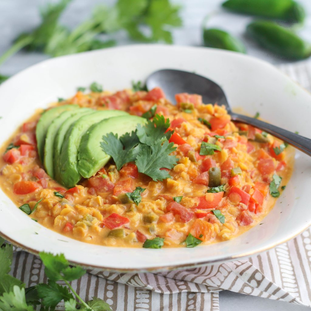 Another one-pot wonder! This red lentil curry comes together in less than 35 minutes and is the perfect cold-weather comfort food. Bell peppers, tomatoes, red lentils, and coconut milk simmered until tender, topped with avocado slices and fresh cilantro.