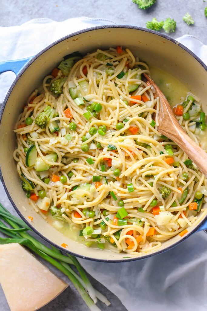 Tender veggies, spaghetti, and a garlicky parmesan sauce make this one-pot spaghetti primavera an easy fix for weeknight dinners.