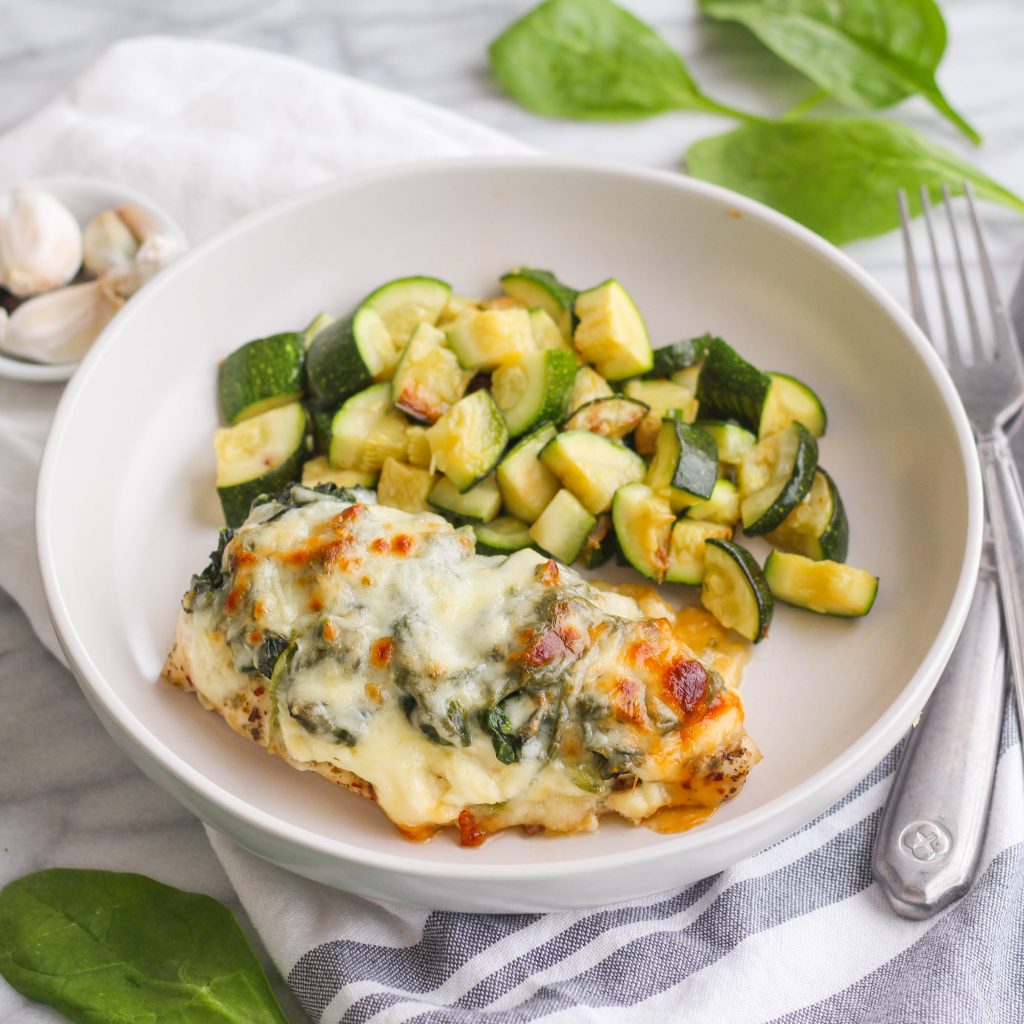 For those nights you want something a little lighter yet still savory and filling! This cheesy spinach chicken bake has two types of cheese and served with a side of roasted zucchini.