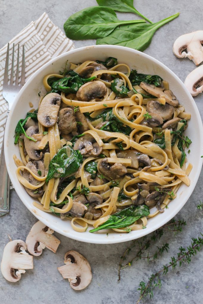A delicious hearty and healthy twist on the classic stroganoff! This vegan mushroom stroganoff has a creamy coconut milk sauce with plenty of fresh thyme and baby spinach.
